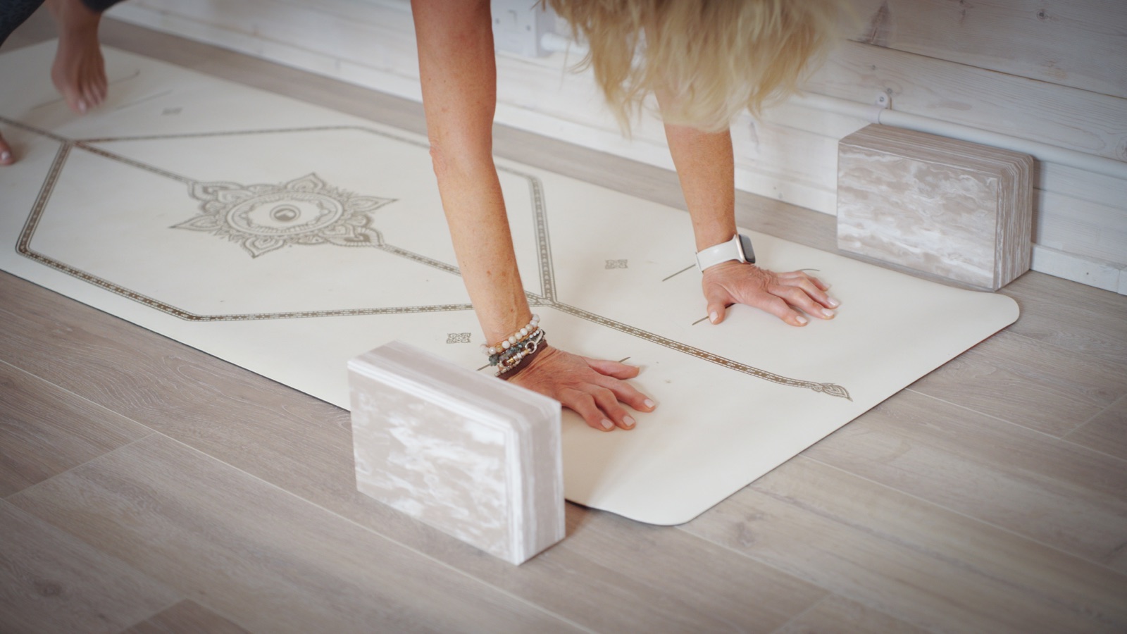 Close-up of hands on yoga blocks