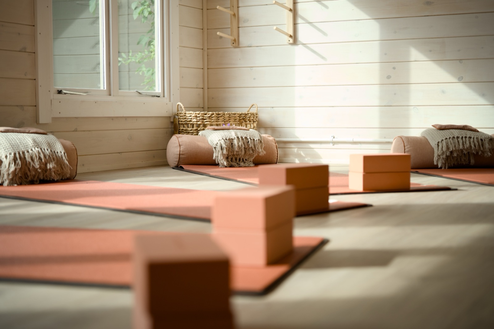 Yoga mats, blocks and bolsters in the studio
