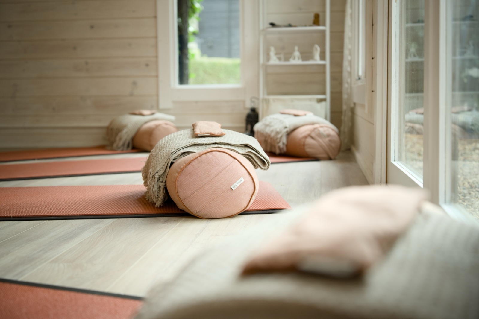 Bolsters and mats laid out in the studio